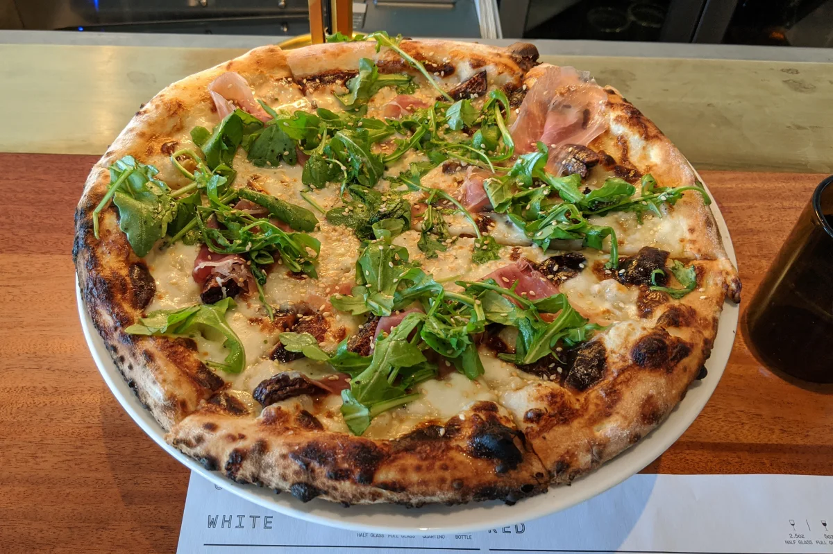 Sixty Vines signature dishes Fig and Prosciutto PizzaBacon Wrapped DatesBraised Pork Pappardelle